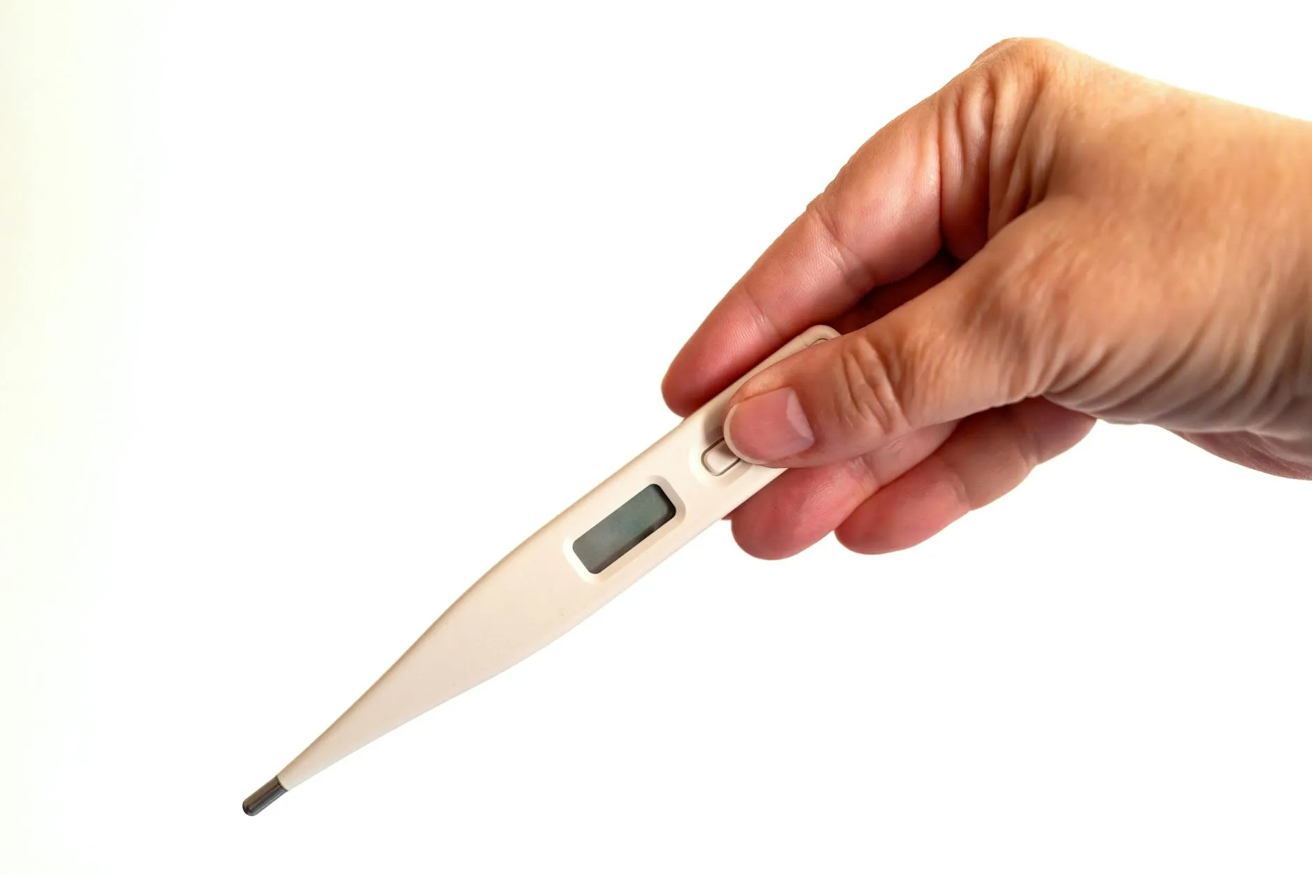 Person measuring temperature with a thermometer