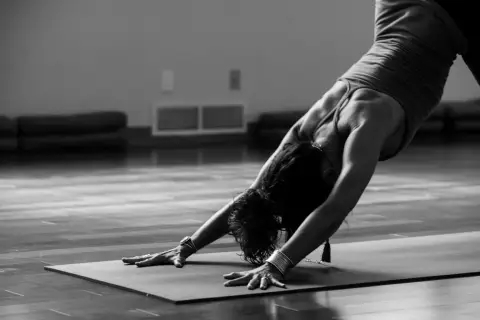 Athlete stretching on a mat before exercise