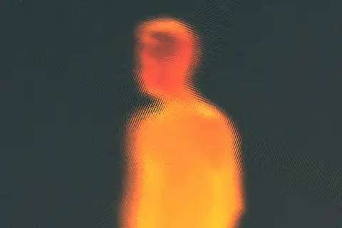Abstract thermal-style image of a human torso glowing orange against a dark background, suggesting something active inside the body that cannot be seen from outside