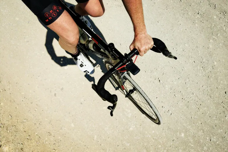 An overhead view of a cyclist riding a road bike