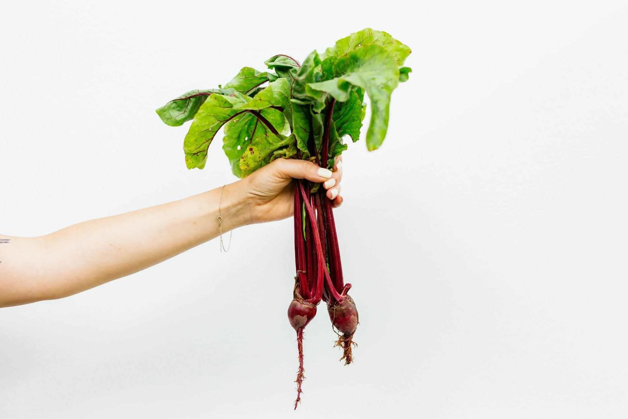 Fresh beetroot and beet juice on a kitchen counter