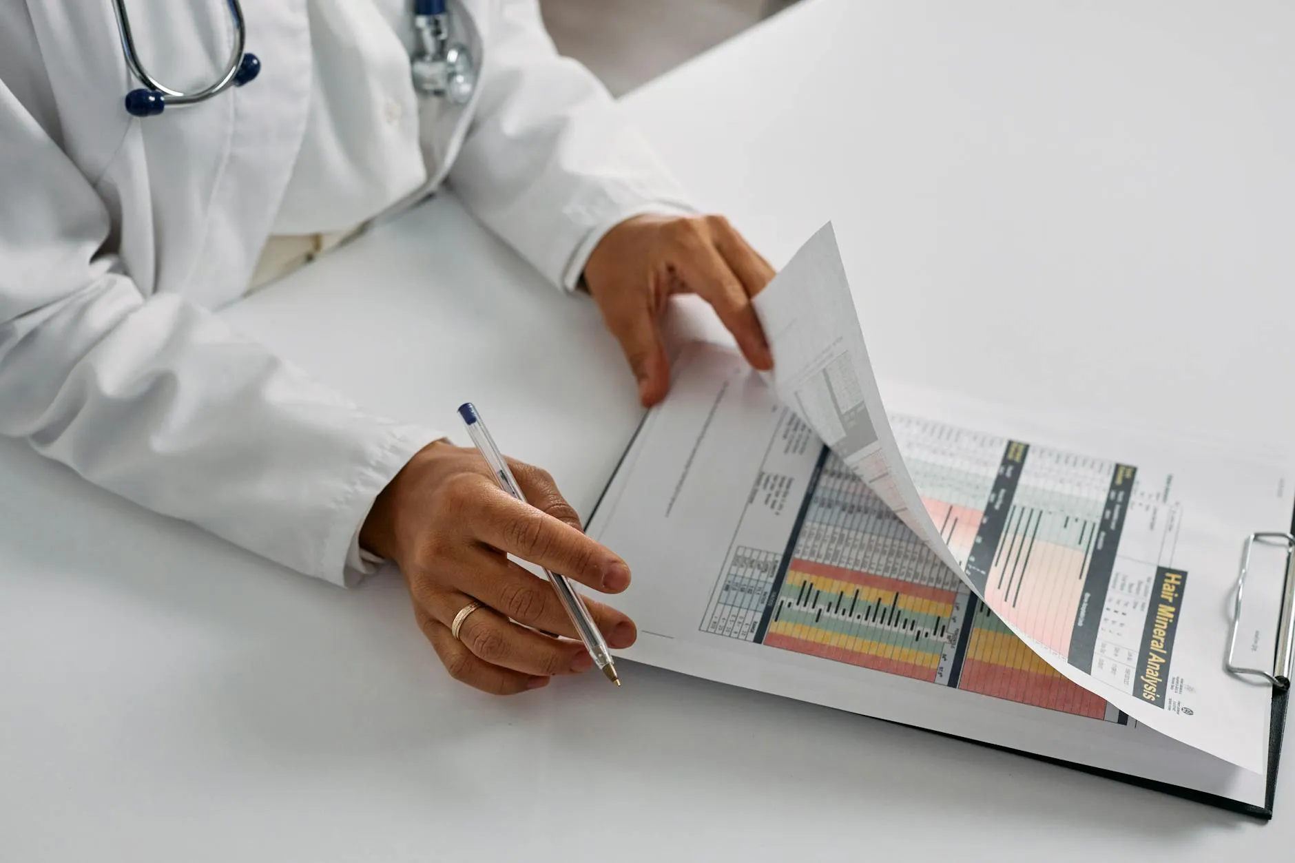 A clinician reviewing a blood test report