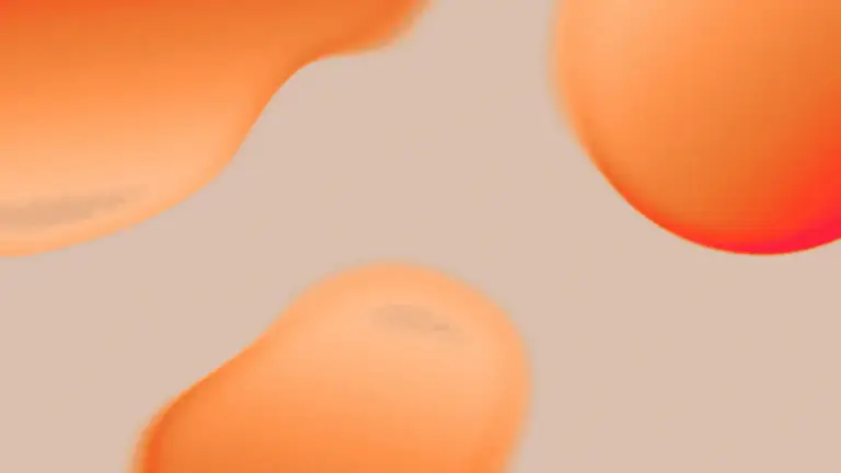 Soft orange abstract droplet shapes on a warm background